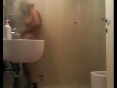 Big-titted blonde showering and getting blown
